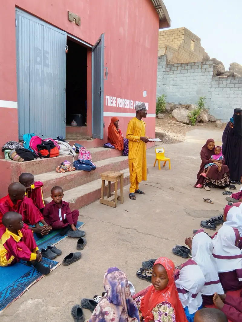 Pupils listening attentively to a staff of FMC Jeff while talking to them